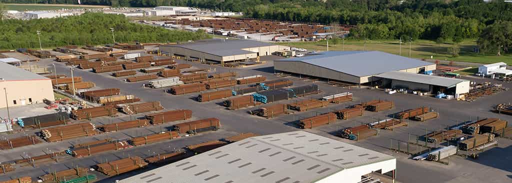 Aerial view of warehouse area filled with brown pipes