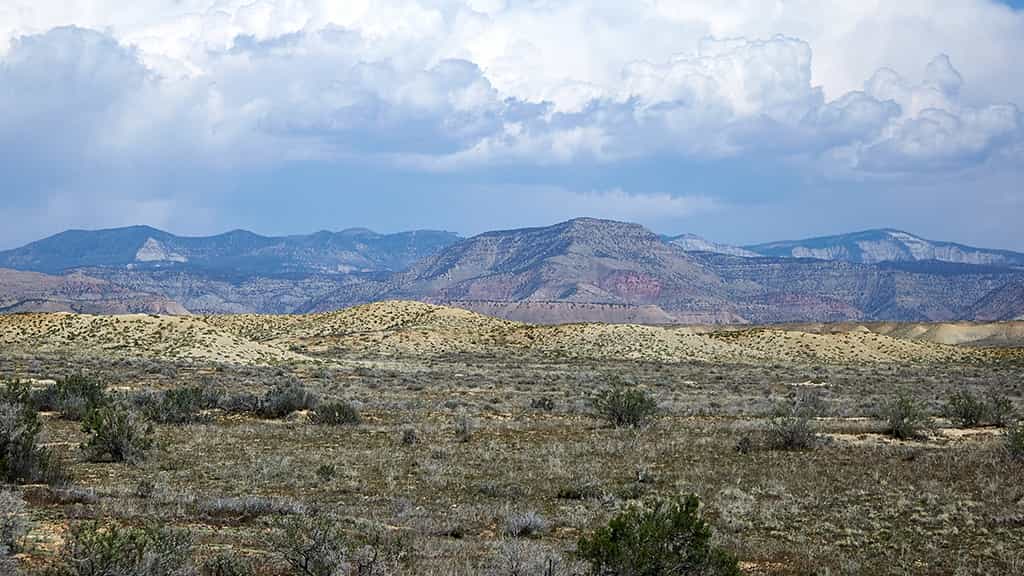 A wide view of dessert mountains in the background
