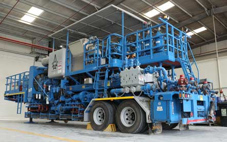 Blue cementinng unit parked in garage