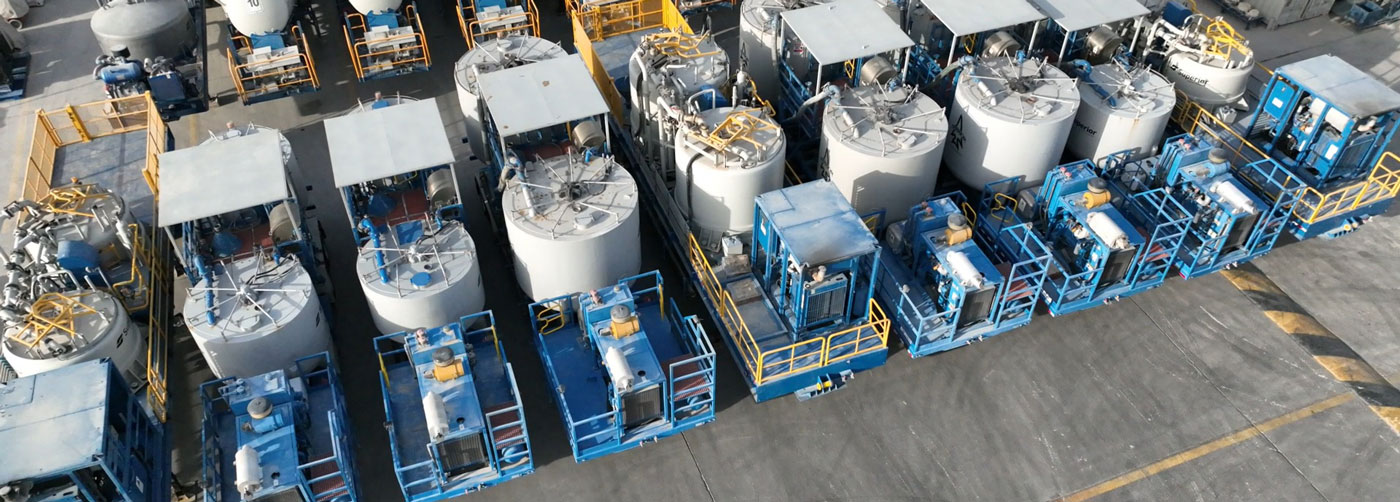 Batch mixers lined up in a parking lot