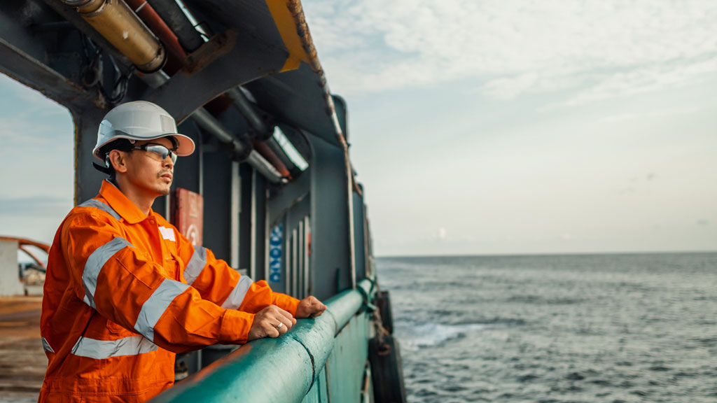 Offshore worker looking to the horizon